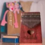 Thumb piano 17 âm thanh Kalimbaqin kalimba10 giai điệu ngón tay piano ngón tay cái piano cầm tay người mới bắt đầu nhạc cụ - Nhạc cụ phương Tây guitarbadon