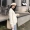 Phụ nữ mang thai áo len nữ mùa thu và mùa đông dài tay thả lỏng thời trang mẹ phiên bản Hàn Quốc của tua rua ngắn màu trắng phụ nữ mang thai mùa thu