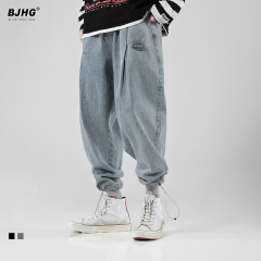 秋冬加厚束腳牛仔褲潮男日系鬆緊彈力工裝寬鬆闊腿休閒哈倫褲