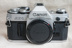 Màu sắc tốt Canon AE-1 AE-1P máy đơn có thể được trang bị máy quay phim đầu để gửi pin thực sự bắn bản đồ nhiều Máy quay phim