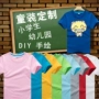 Bông trẻ em vòng cổ ngắn tay T-Shirt mẫu giáo trường tiểu học dịch vụ đẳng cấp trống vẽ tay áo tuỳ chỉnh DIY in ấn thời trang bé gái