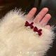 Игла из серебра 925 пробы бордового цвета.