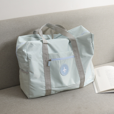 taobao agent Handheld one-shoulder bag, capacious waterproof bag, clothing