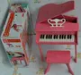 Hape trẻ em piano nhỏ 30 phím tam giác dọc bé nhạc cụ câu đố cô gái đồ chơi bằng gỗ đàn organ đồ chơi cho bé