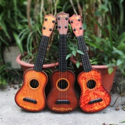 Ukulele đồ chơi guitar cho trẻ em người mới bắt đầu có thể chơi nữ boy bé âm nhạc giác ngộ mô phỏng cụ