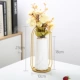 Большая белая железная ваза с цветами
