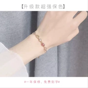 Dâu tây tự nhiên pha lê blonde pha lê tinh thể moonstone transporter Taohuawang sự nghiệp 14 k sinh nhật vàng vòng đeo tay nữ