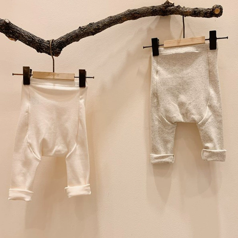 quần áo mùa xuân và mùa thu tại Hàn Quốc cho nam và nữ em bé bông hoang dã xà cạp PP lớn sơ sinh quần dài đôi cạp cao - Quần