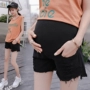 2018 mới cộng với phân bón XL phụ nữ mang thai jeans quần short 200 kg mùa hè mặc bên ngoài phụ nữ mang thai dạ dày lift quần quần bầu cạp chéo