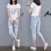 Trạm châu âu 2018 mùa xuân và mùa hè mới của phụ nữ hoa T-Shirt + jeans giản dị hai mảnh thời trang phù hợp với nữ triều quần jean rách hàn quốc Quần jean