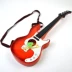 Đàn guitar mô phỏng nhỏ bằng nhựa, có thể chơi bốn dây, biểu diễn sân khấu mẫu giáo, đồ chơi âm nhạc cho trẻ em