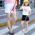 Quần short denim bé gái hè 2019 mới to bỉm quần trắng lỗ nước ngoài Quần trẻ em Hàn Quốc - Quần jean chân váy trẻ em Quần jean