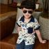 Trẻ em của mặc 2018 mùa hè cậu bé mới Hàn Quốc ngắn tay áo cậu bé áo hoa bé con mùa hè bông áo sơ mi Áo sơ mi
