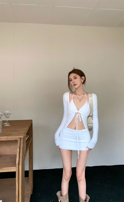 taobao agent Knitted sexy cardigan, demi-season white mini-skirt, lifting effect, hip-accented