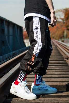 Hip hop quần nam lỏng Harlan Hàn Quốc phiên bản của xu hướng của Châu Âu và Mỹ cá tính đường phố mặc lỗ mặc giản dị quần quần đồ công sở nam Quần Harem