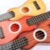 Đàn guitar của trẻ em có thể chơi nhạc cụ mô phỏng đàn ukulele mini đàn ông và phụ nữ bé nhạc nhỏ guitar nhựa đồ chơi