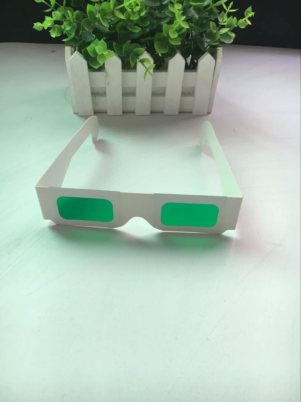 Lens, disposable green glasses