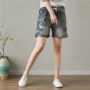 Real shot phong cách quốc gia size lớn chất béo MM mùa hè thêu thun eo quần jeans hoang dã cũ mặc quần short co giãn eo phụ nữ quần jeans nữ