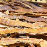 Измеряющийся кальмар кальмара, кусочки каракатицы, морепродукты, нежная версия морепродуктов сушеного сухого сухого кальмара.