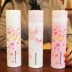 Hàn Quốc Thời trang Sáng tạo Sakura Tươi Xử lý Cup Cách nhiệt Cá tính Chân không Bounce Cap Cup Nữ cầm tay - Tách