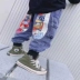 Quần jean nam mùa xuân và mùa thu 2020 mới của Hàn Quốc mặc quần yếm in hình cá tính cho trẻ em - Quần jean